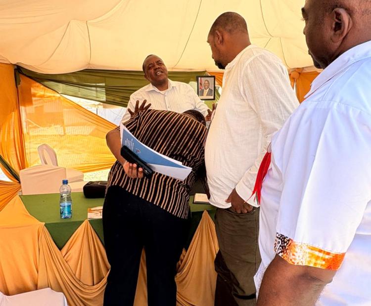 The Tribunal CEO Mr Julius Mutua engaging the Kenya Sugar Board Deputy Director Fund Management,Mr Daniel Onyango and  Mr Henry Nyagah,the Mombasa Agricultural Show chairman during their visit to the Tribunal's stand